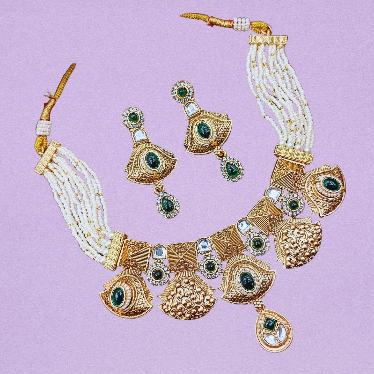 Rajwadi ethnic necklace for women featuring gold-tone design with green gemstones and matching earrings