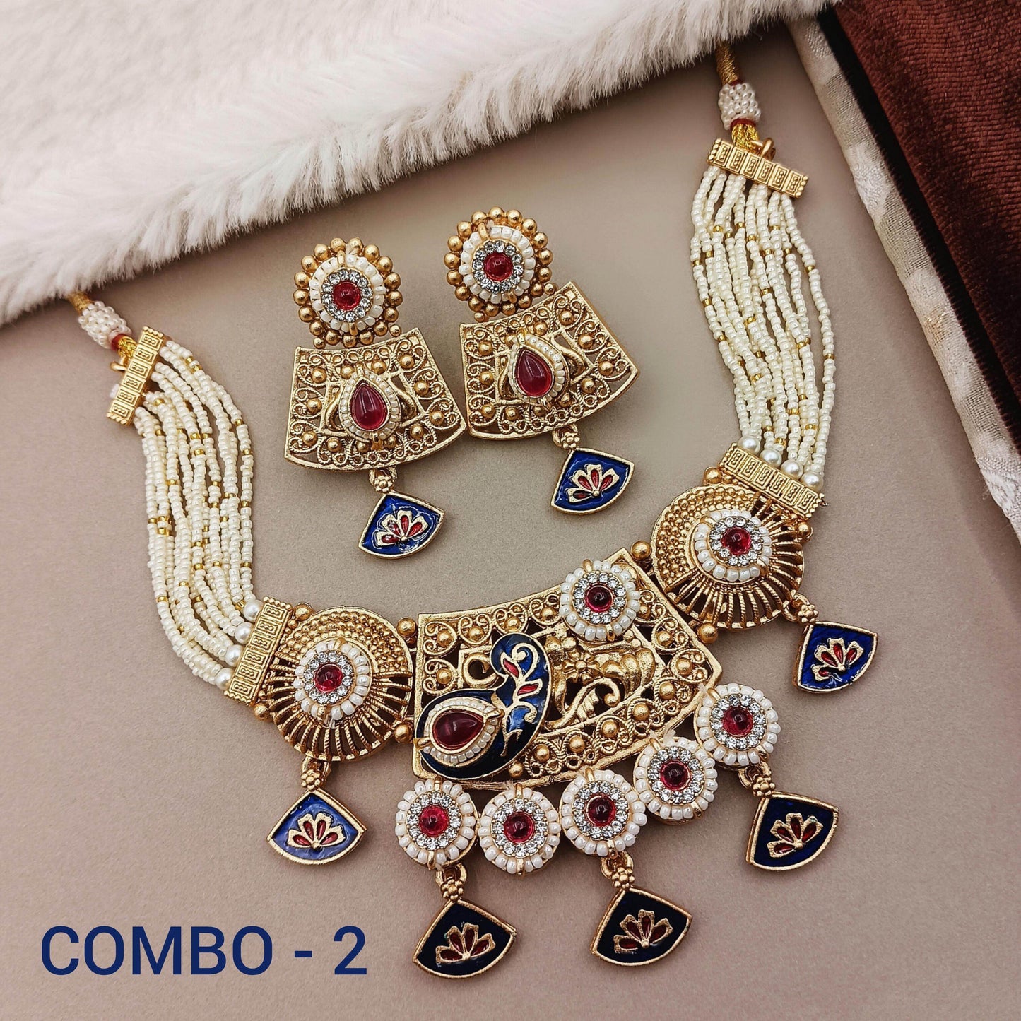 Rajwadi necklace set for women with intricate gold design, red and blue accents, and matching earrings