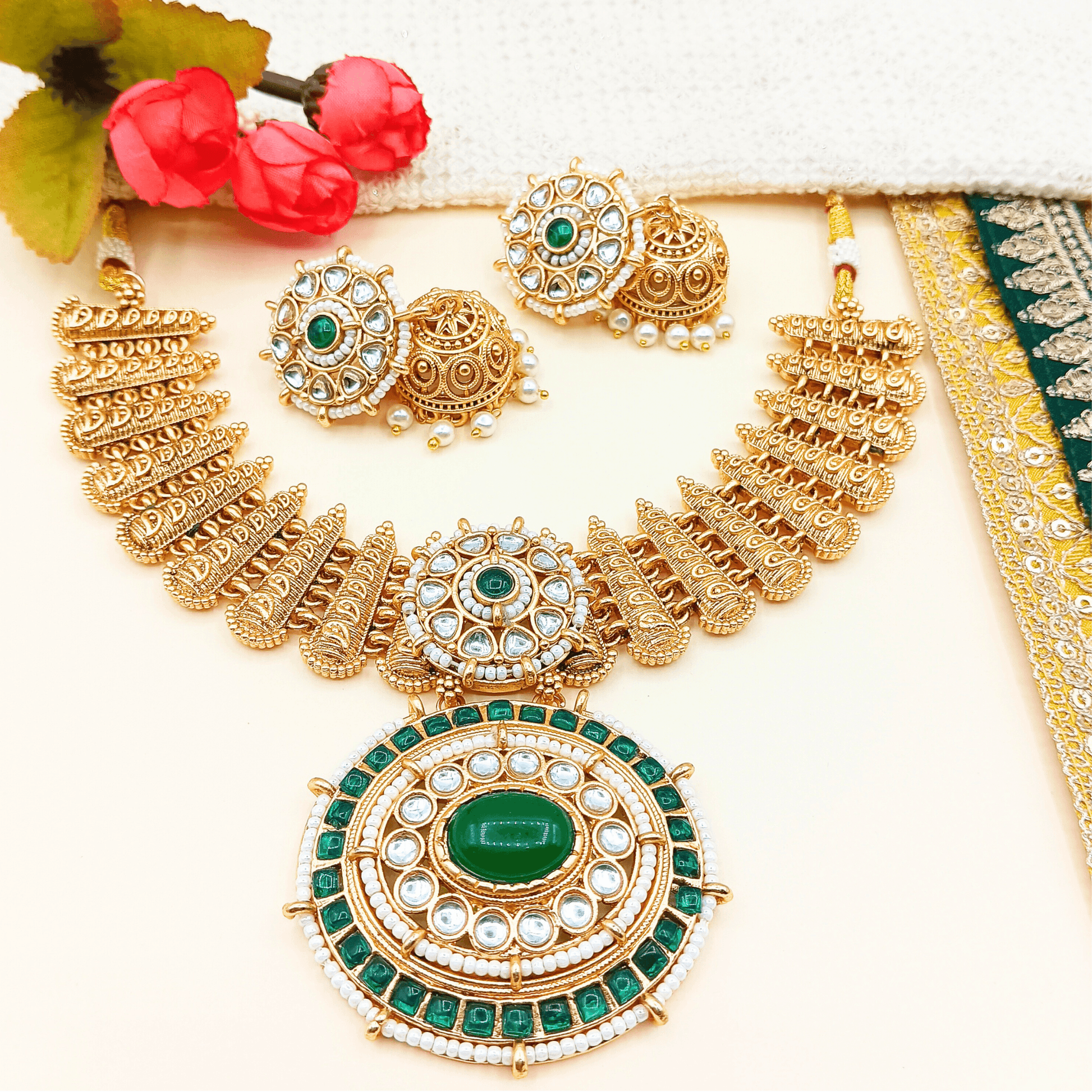 Aditi royal Indian necklace set online featuring gold tone with green and white stones and matching earrings