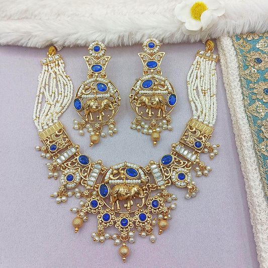Rajputi elephant design necklace set with blue stones and pearl bead strands in gold tone