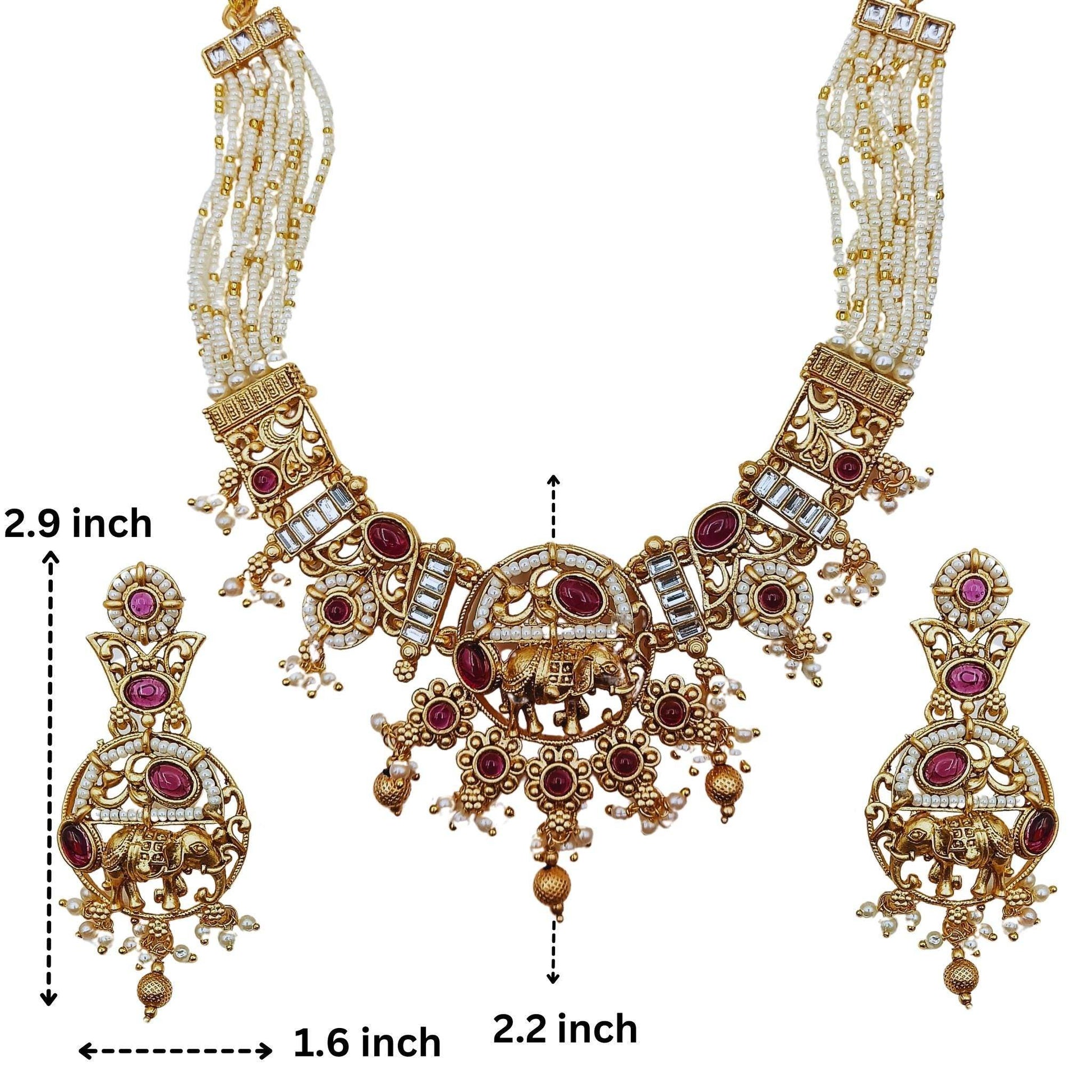 Rajputi elephant design necklace set with intricate gold and red stone detailing and matching earrings