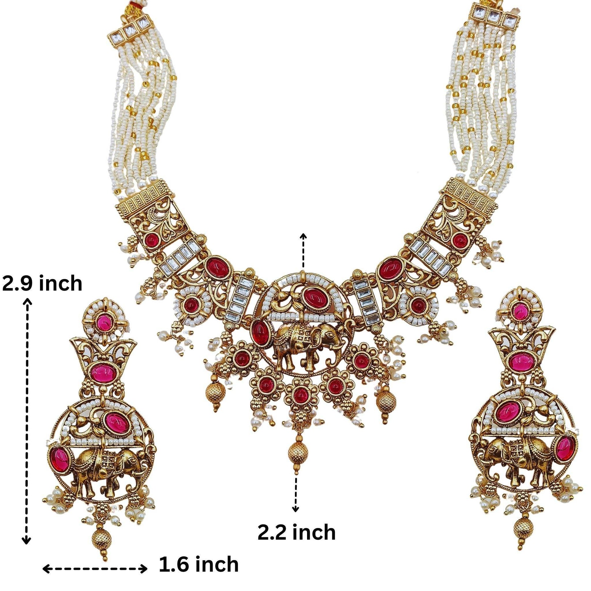 Rajputi elephant design necklace set with intricate gold detailing and red gemstone accents