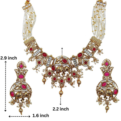 Rajputi elephant design necklace set with intricate gold detailing and red gemstone accents