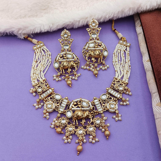 Rajputi elephant design necklace set with intricate gold detailing and pearl accents