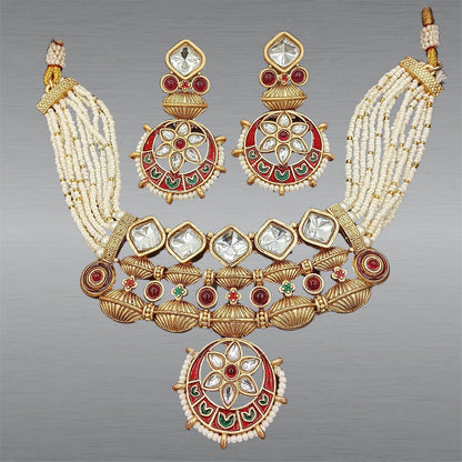 Rajwadi jewelry set for women with traditional gold tone, red and green enamel work, and pearl bead strands